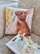 Load image into Gallery viewer, Meadow Hare Cushion WIth Yellow Pom Poms

